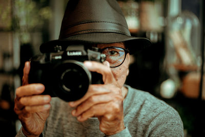 Portrait of man photographing