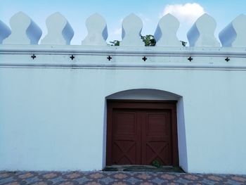 Low angle view of building against blue sky