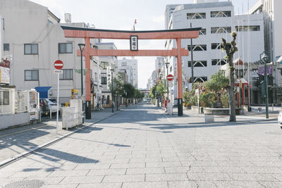 Street amidst buildings in city against sky