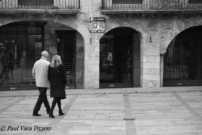 Woman standing in front of building