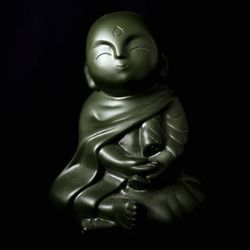 Close-up of statue against black background