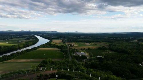 Scenic view of landscape against cloudy sky