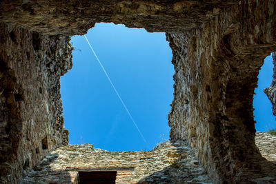 Vapor trail against clear blue sky