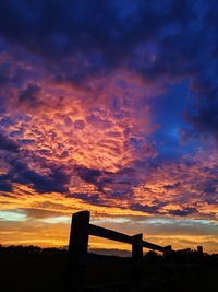 Low angle view of silhouette bridge against sky during sunset