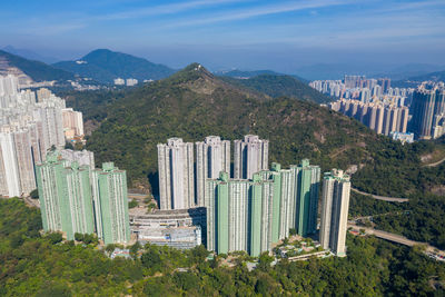 High angle view of buildings in city against sky