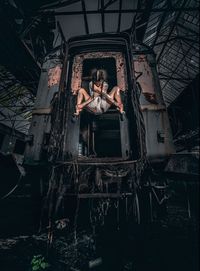 Portrait of woman in abandoned building