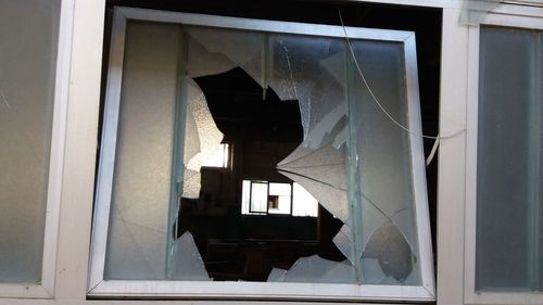 Close-up of window of abandoned building