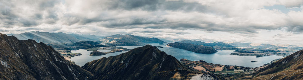 Panoramic view of mountains against cloudy sky