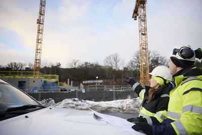 Engineers talking at building site