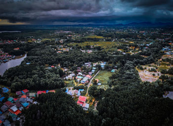 High angle view of trees and buildings against sky