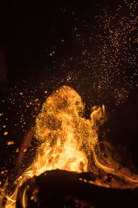 Close-up of illuminated bonfire at night