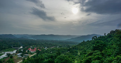 High angle view of trees and buildings against sky