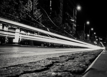 Light trails on road in city at night