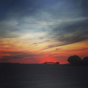 Scenic view of silhouette landscape against sky during sunset