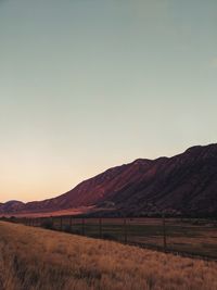 Scenic view of field against sky during sunset