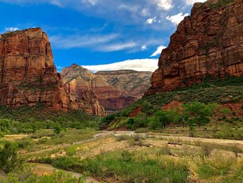 Rock formations on landscape against sky