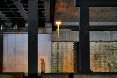 Low angle view of lamp post at night