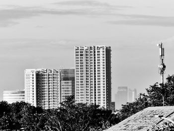 Skyscrapers in city against sky