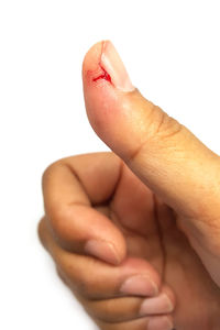 Close-up of human hand against white background