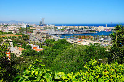 High angle view of buildings in town against sky