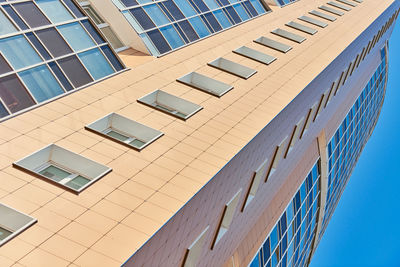 Low angle view of modern building against clear sky