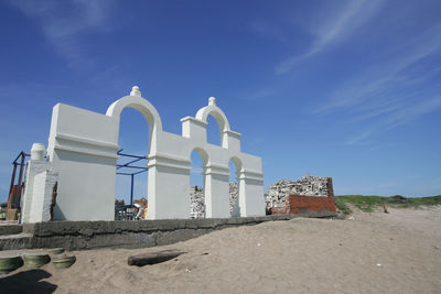 Low angle view of building against blue sky