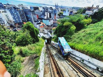 High angle view of railroad tracks amidst buildings in city