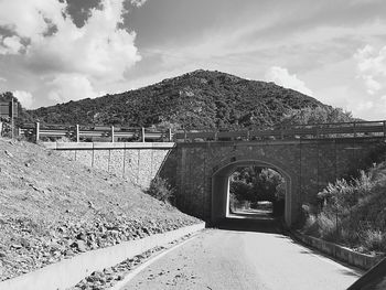 Arch bridge against sky