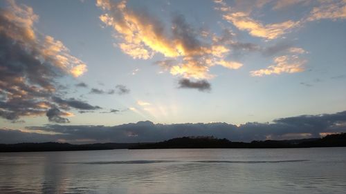 Scenic view of lake against sky during sunset