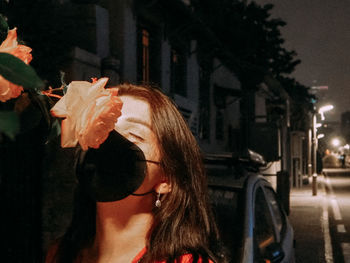 Portrait of young woman in park