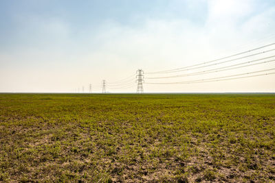 Scenic view of field against sky at morning