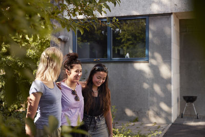 Young female friends spending time together outdoors