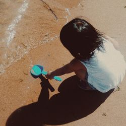 Shadow of man playing with ball