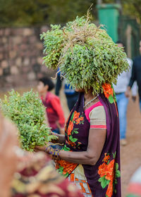 Rear view of woman standing outdoors