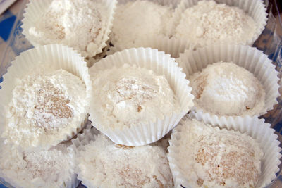 High angle view of powdered sugar on desserts