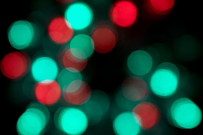 Defocused image of illuminated lights at night