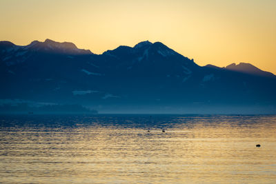 Scenic view of sea against sky during sunset