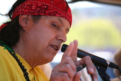 Close-up of man gesturing while talking in microphone