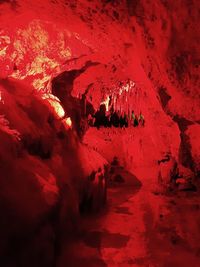 Close-up of red rock formations in cave