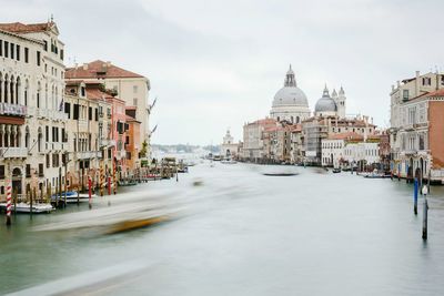 River amidst canal against sky