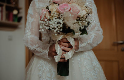 Woman holding flower bouquet