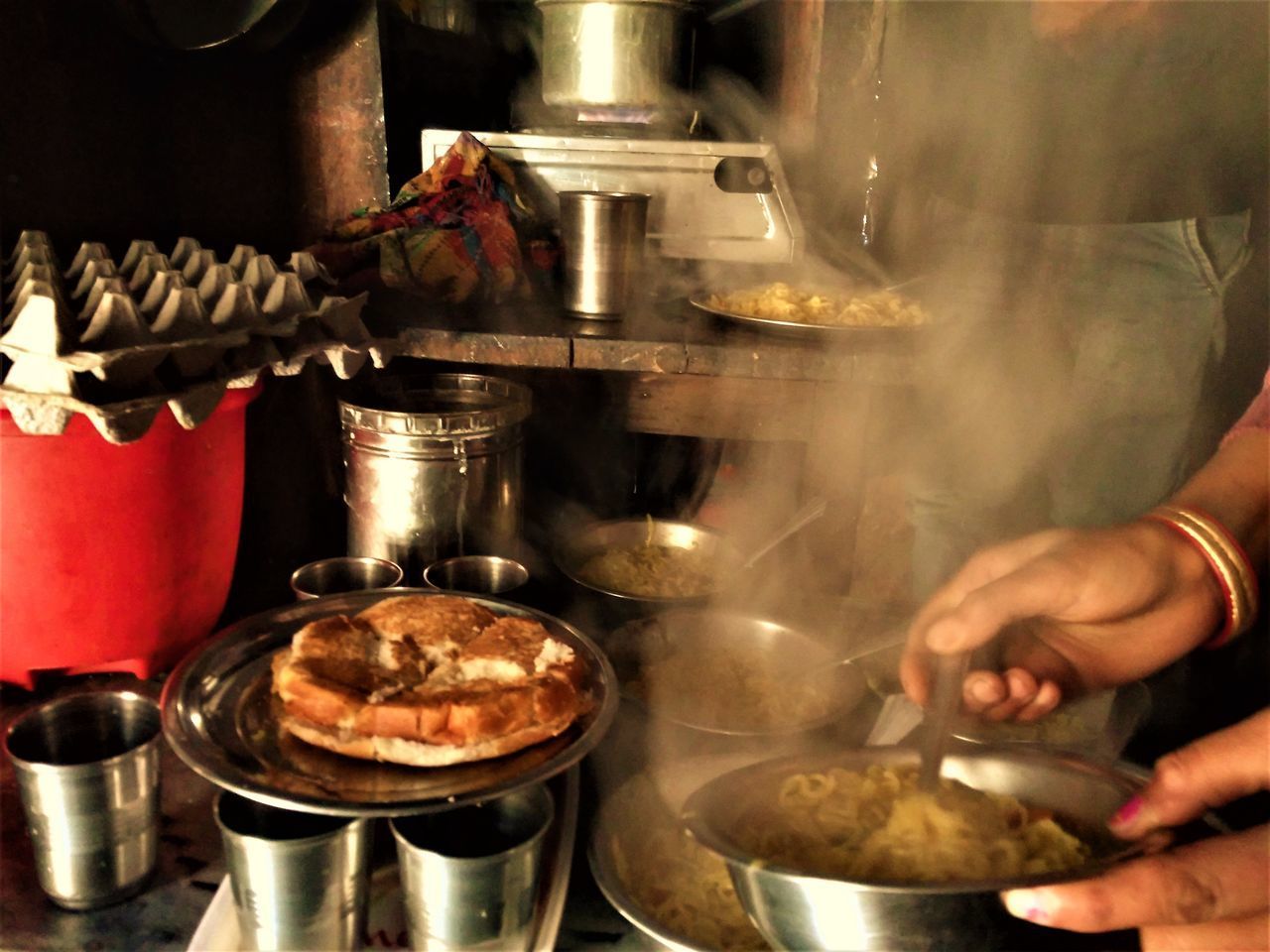 CLOSE-UP OF HAND PREPARING FOOD