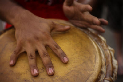 Midsection of man playing piano