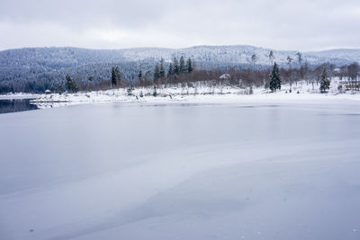 Scenic view of frozen lake against sky