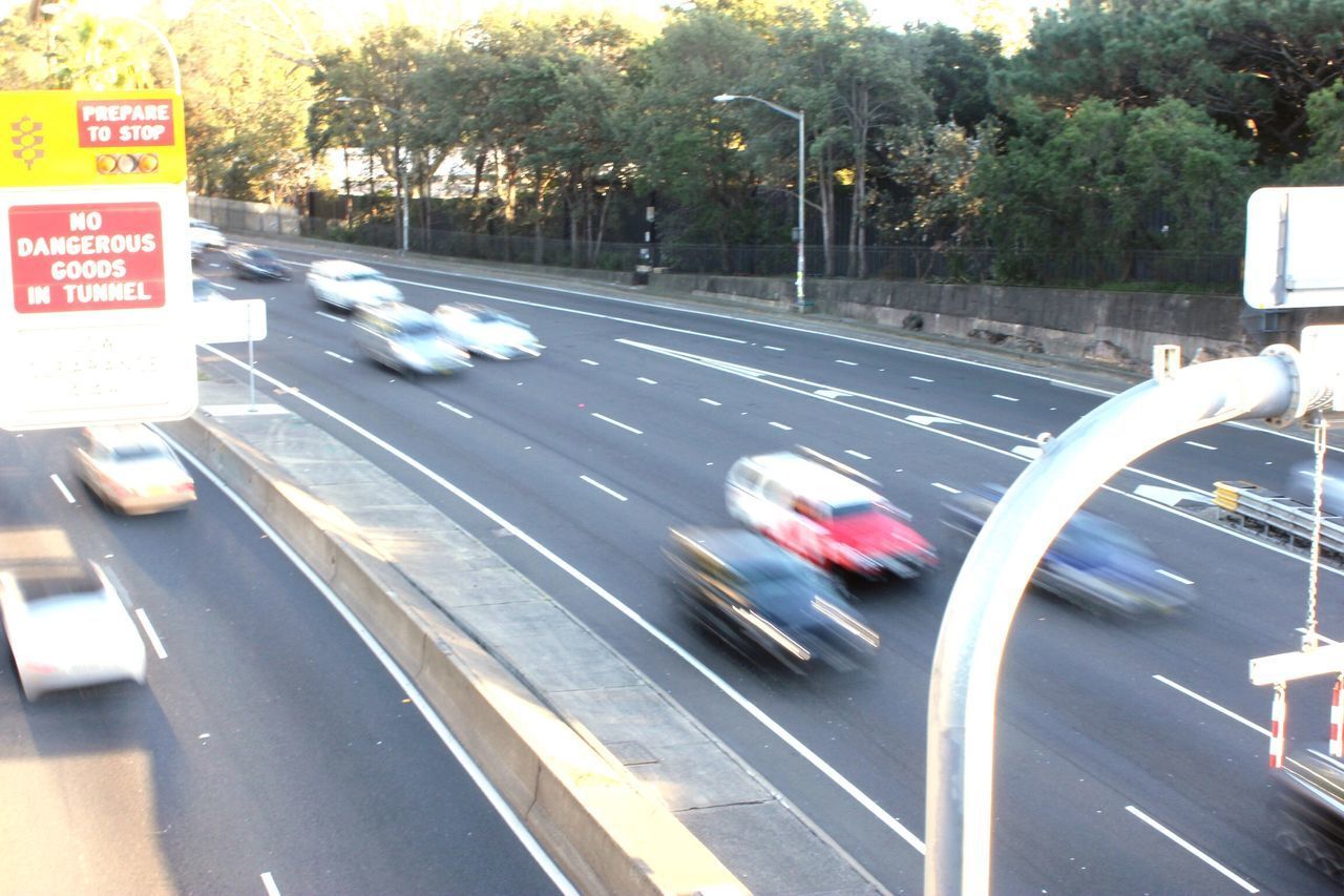 BLURRED MOTION OF CARS ON ROAD