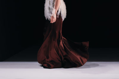 Elegant women fashion, brown silk dress and white blouse with feathers, chic clothes outfit