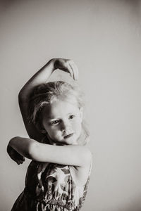 Girl dancing against wall