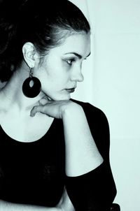 Portrait of young woman on wall