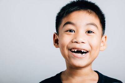 Portrait of young man against white background