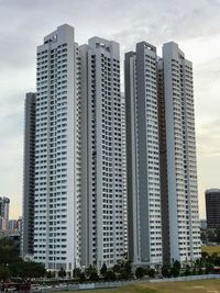 Modern buildings in city against sky